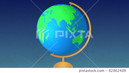 Image of globe spinning on stand against blue background Image of globe spinning on stand against blue background 82802489