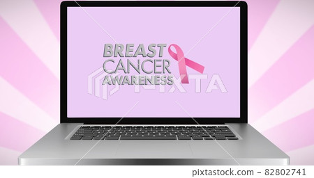 Composition of pink ribbon logo and breast cancer text on the laptop screen Composition of pink ribbon logo and breast cancer text on the laptop screen 82802741