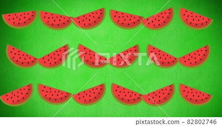 Composition of rows of watermelon slices on green background Composition of rows of watermelon slices on green background 82802746