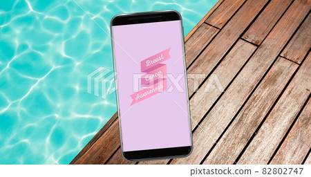 Composition of pink ribbon logo and breast cancer text on the smartphone screen Composition of pink ribbon logo and breast cancer text on the smartphone screen 82802747