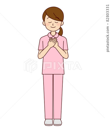 Female nurse putting her hand on her chest Female nurse putting her hand on her chest 82803331