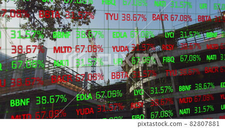 Financial data over building site. Financial data over building site. 82807881