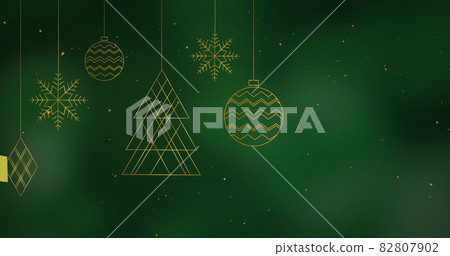 Digital image of golden confetti falling over christmas decorations hanging Digital image of golden confetti falling over christmas decorations hanging 82807902