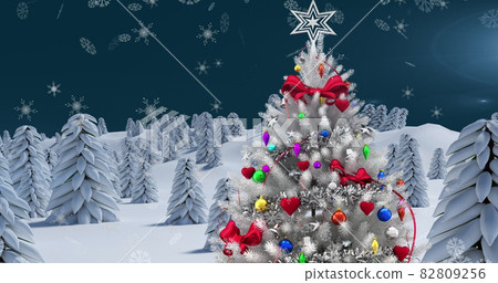 Image of winter scenery with christmas tree and snow falling on blue background 82809256