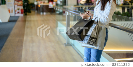 Black Friday and Boxing Day. Woman shopping alone for new clothes and relax on holiday 82811223
