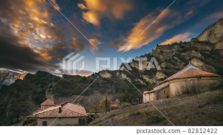 Mtskheta, Georgia. Shio-Mgvime Monastery. Upper Church Of Holy Virgin Or Theotokos, Central Part Of Medieval Monastic ShioMgvime Complex In Limestone Canyon In Autumn Sunset. 4K Mtskheta, Georgia. Shio-Mgvime Monastery. Upper Church Of Holy Virgin Or Theotokos, Central Part Of Medieval Monastic ShioMgvime Complex In Limestone Canyon In Autumn Sunset. 4K 82812422