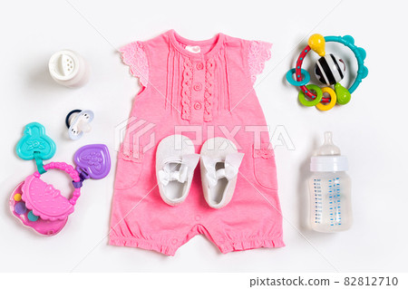 Baby clothes and accessories on white background. Top view 82812710
