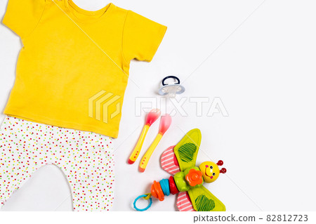 Baby clothes and accessories on white background. Top view Baby clothes and accessories on white background. Top view 82812723
