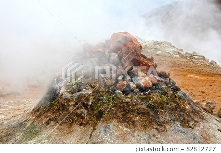 Steaming fumarole in geothermal area of Hverir, Iceland Steaming fumarole in geothermal area of Hverir, Iceland 82812727