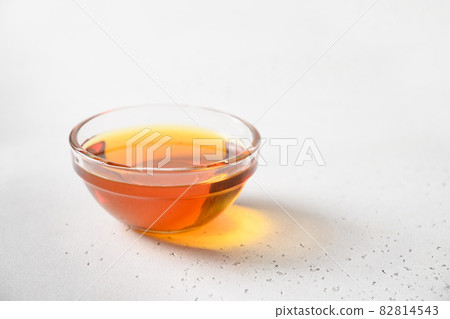 Jerusalem artichoke topinambour syrup of flowers root in glass bowl. Jerusalem artichoke topinambour syrup of flowers root in glass bowl. 82814543
