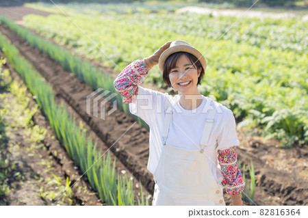 Cute woman working in the field 82816364