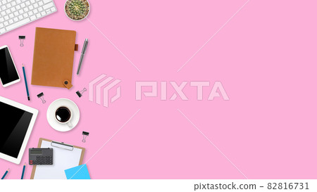 flat lay workspace table with laptop computer, office supplies, coffee cup, tablet and cell phone on pink pastel background 82816731