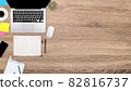flat lay workspace table with laptop computer, office supplies, coffee cup, tablet and cell phone on wooden background 82816737