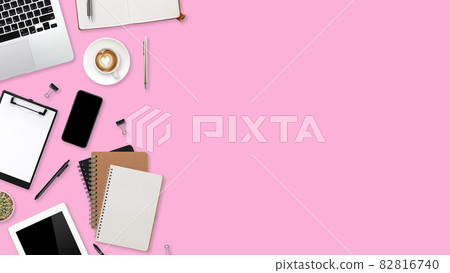 flat lay workspace table with laptop computer, office supplies, coffee cup, tablet and cell phone on pink pastel background flat lay workspace table with laptop computer, office supplies, coffee cup, tablet and cell phone on pink pastel background 82816740