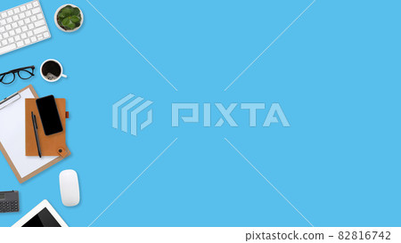 flat lay workspace table with laptop computer, office supplies, coffee cup, tablet and cell phone on blue pastel background flat lay workspace table with laptop computer, office supplies, coffee cup, tablet and cell phone on blue pastel background 82816742