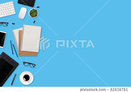 flat lay workspace table desk with laptop computer, office supplies, coffee cup, tablet and mobile smartphone on color background flat lay workspace table desk with laptop computer, office supplies, coffee cup, tablet and mobile smartphone on color background 82816781