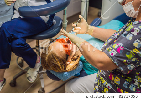 Woman having teeth examined at dentists. Dental treatment in dentistry. Appointment at the dentist. lifestyle, real life 82817059