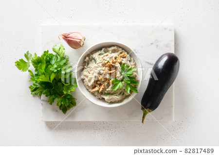 Baba ganoush from baked eggplant with parsley, garlic. View from above. 82817489
