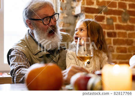 Little cute girl, kid visit grandparents and celebrate Thanksgiving day at home, indoors. Family, holiday concept. 82817766