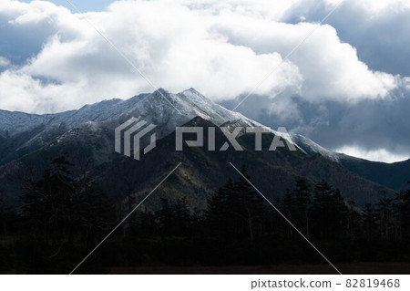 Ishikari mountain range with clouds approaching Nipe's ears 82819468