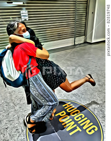 Color painting of two people hugging each other on a writing on the floor where it says hugging point 82819748