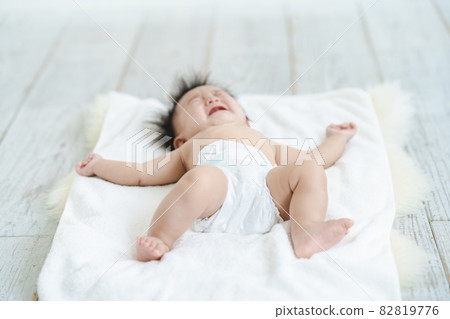 Baby crying in a diaper Baby crying in a diaper 82819776