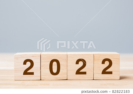 2022 wooden cube blocks on table background. Resolution, plan, review, goal, start and New Year holiday concepts 82822183