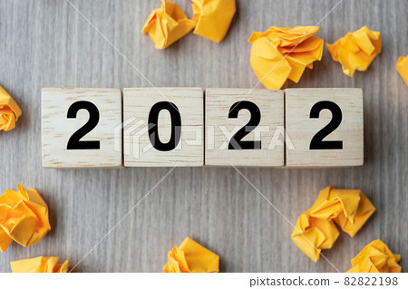 2022 text wood cube and crumbled paper on wooden table background. New Year New Ideas, Creative, Innovation, Imagination, inspiration, Resolution, Strategy and goal concept 82822198