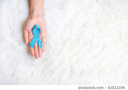November Prostate Cancer Awareness month, Man holding light Blue Ribbon for supporting people living and illness. Healthcare, International men, Father, World cancer day and world diabetes day concept 82822206