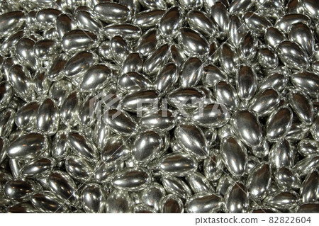 A pile of sweets of metallic color as a background. Candy close-up. A pile of sweets of metallic color as a background. Candy close-up. 82822604