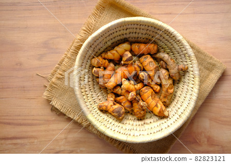 top view of turmeric root in bowl on table , 82823121
