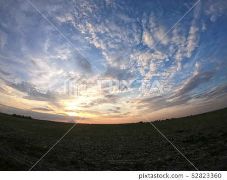 Evening landscape shot with the effect of a fish eye. Dramatic sky. Evening landscape shot with the effect of a fish eye. Dramatic sky. 82823360