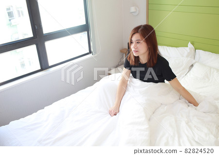 woman wellbeing wake up on morning 82824520