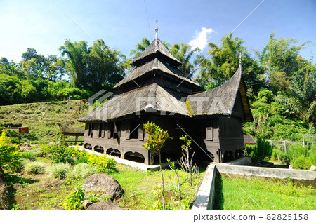 WEST SUMATERA, INDONESIA -JUNE 8, 2014: Tuo Kayu Jao Mosque is located in West Sumatra, Indonesia. Built in 1599 and is the second oldest mosque in Indonesia. WEST SUMATERA, INDONESIA -JUNE 8, 2014: Tuo Kayu Jao Mosque is located in West Sumatra, Indonesia. Built in 1599 and is the second oldest mosque in Indonesia. 82825158