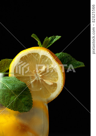 Cold refreshing drink with lemon slices and mint. 82825566