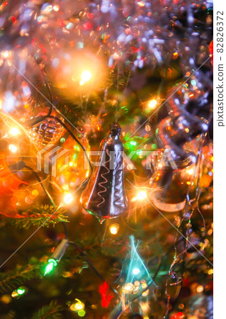 Decorations on fir-tree branches for New Year and holidays. 82826372