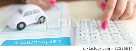 Client of insurance company calculates cost of car insurance Client of insurance company calculates cost of car insurance 82826614