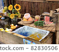 Summer memories, sunflowers, chilled cucumbers and fruits 82830506