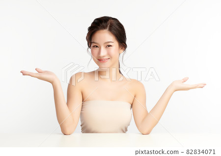 Beautiful young asian woman with clean fresh skin on white background, Face care, Facial treatment, 82834071