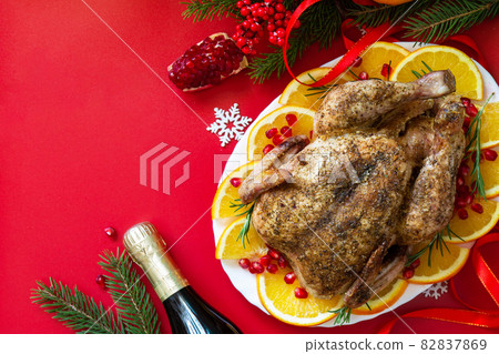 Winter Holiday table Christmas dinner. Baked turkey on red background. Top view flat lay background. Copy space. Winter Holiday table Christmas dinner. Baked turkey on red background. Top view flat lay background. Copy space. 82837869