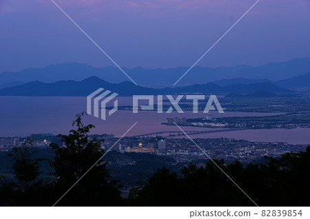 Lake Biwa Bridge at dusk overlooking from the Oku Hiei Driveway Lake Biwa Bridge at dusk overlooking from the Oku Hiei Driveway 82839854