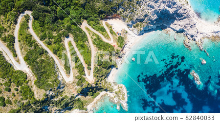 Aerial view Agia Eleni beach in Kefalonia Island, Greece. Remote beautiful rocky beach with clear emerald water and high white cliffs Aerial view Agia Eleni beach in Kefalonia Island, Greece. Remote beautiful rocky beach with clear emerald water and high white cliffs 82840033