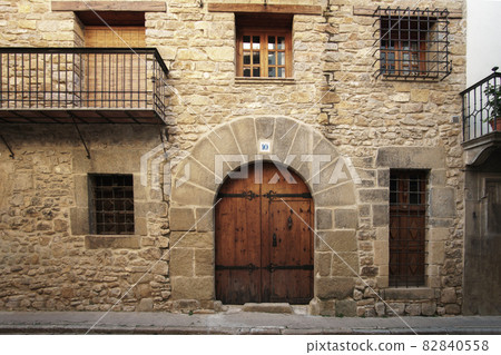 traditional stone facade of a 2-storey house 16th century architecture, Rubielos de Mora traditional stone facade of a 2-storey house 16th century architecture, Rubielos de Mora 82840558