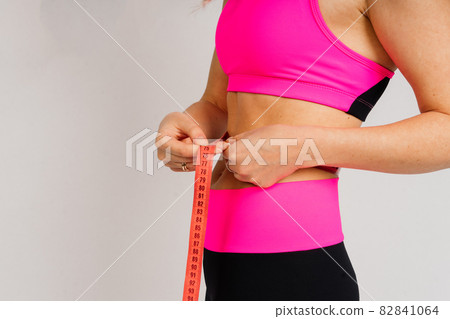 Attractive blonde caucasian smiling woman isolated on white, blue. Studio shot looking at camera Attractive blonde caucasian smiling woman isolated on white, blue. Studio shot looking at camera 82841064