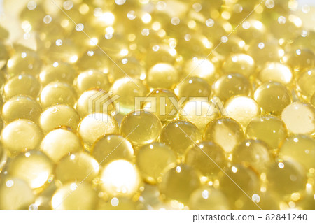 soft yellow gelatine capsules. close-up. pharmaceutical production.  82841240