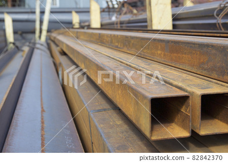 Metal profile pipe of rectangular cross section in packs at the warehouse of metal products Metal profile pipe of rectangular cross section in packs at the warehouse of metal products 82842370