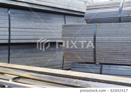 Metal profile pipe of rectangular cross section in packs at the warehouse of metal products Metal profile pipe of rectangular cross section in packs at the warehouse of metal products 82842417