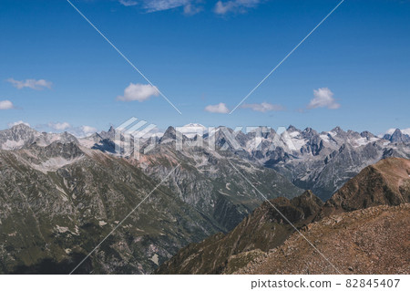 Panorama view of dramatic sky and mountains scene in national park Dombay Panorama view of dramatic sky and mountains scene in national park Dombay 82845407