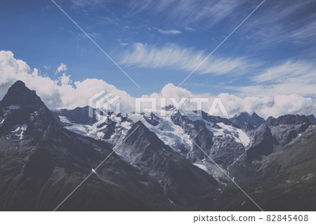 Panorama view of dramatic sky and mountains scene in national park Dombay Panorama view of dramatic sky and mountains scene in national park Dombay 82845408