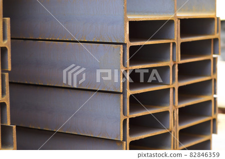 Metal profile beam in packs at the warehouse of metal products Metal profile beam in packs at the warehouse of metal products 82846359